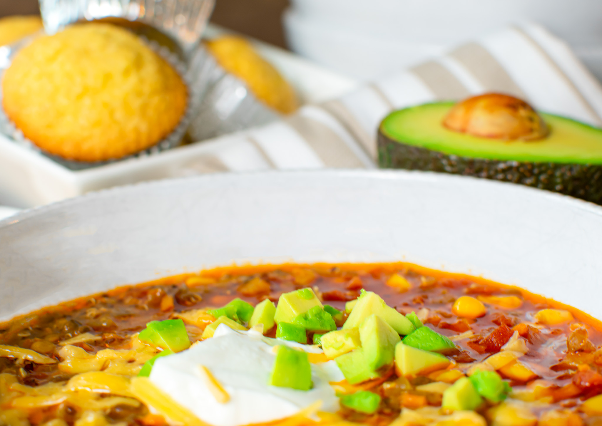 Meatless vegetarian chili with corn muffins and fresh avocado