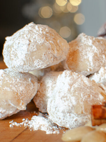 Cinnamon Spice Snowball Cookies with Marcona Almonds and cinnamon sticks