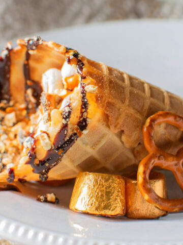 Hershey's Loaded Smores in a Cone. Pretzels, rolo caramels, marshmallows, and crushed graham cracker for campfire in a cone vibes