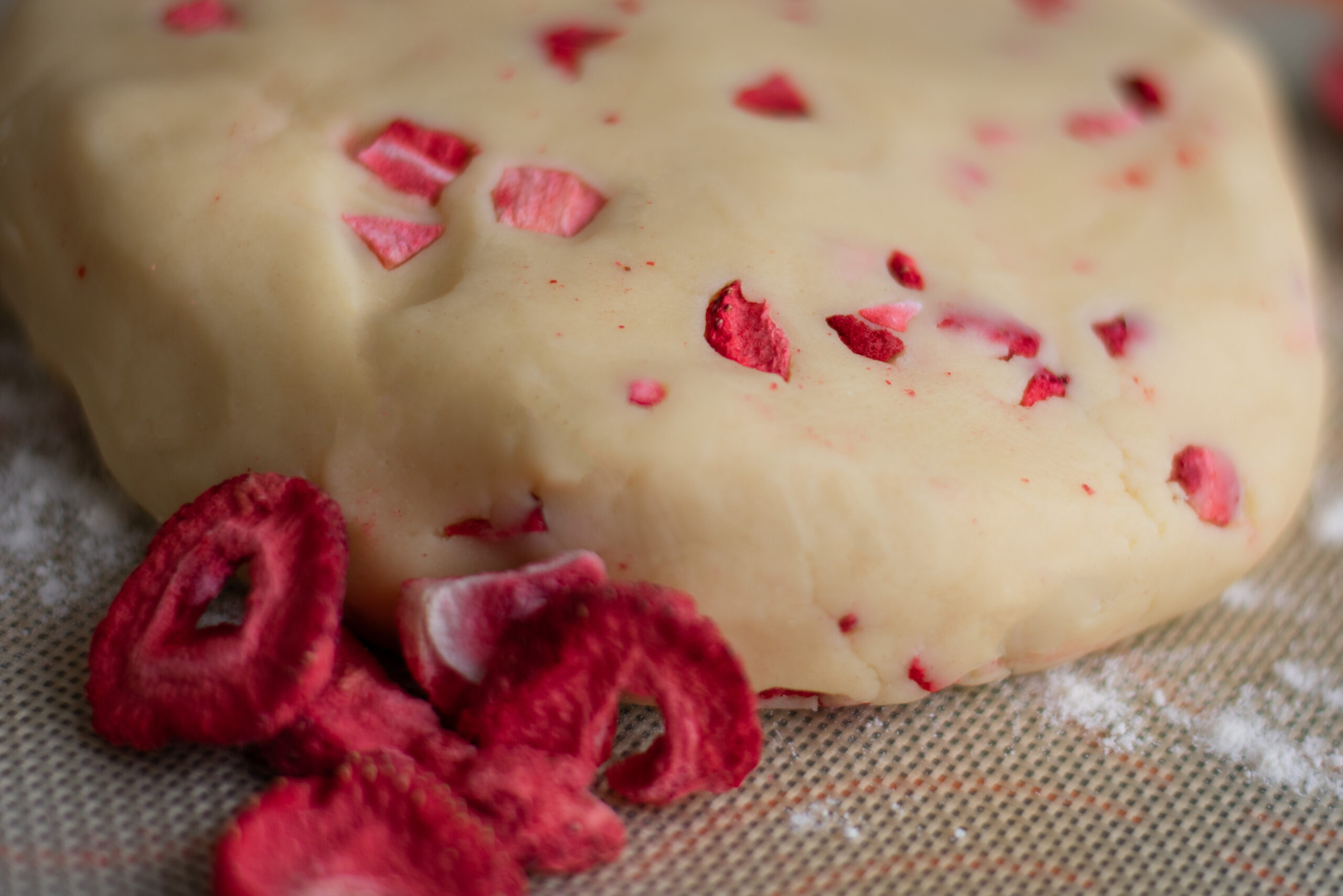 Strawberry Flecked Shortbread Cookie Dough on a floured mat