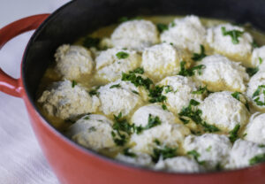 Cozy bowl of Chickpea Dumpling Soup with fluffy dumplings and creamy vegetable broth pinterest pin