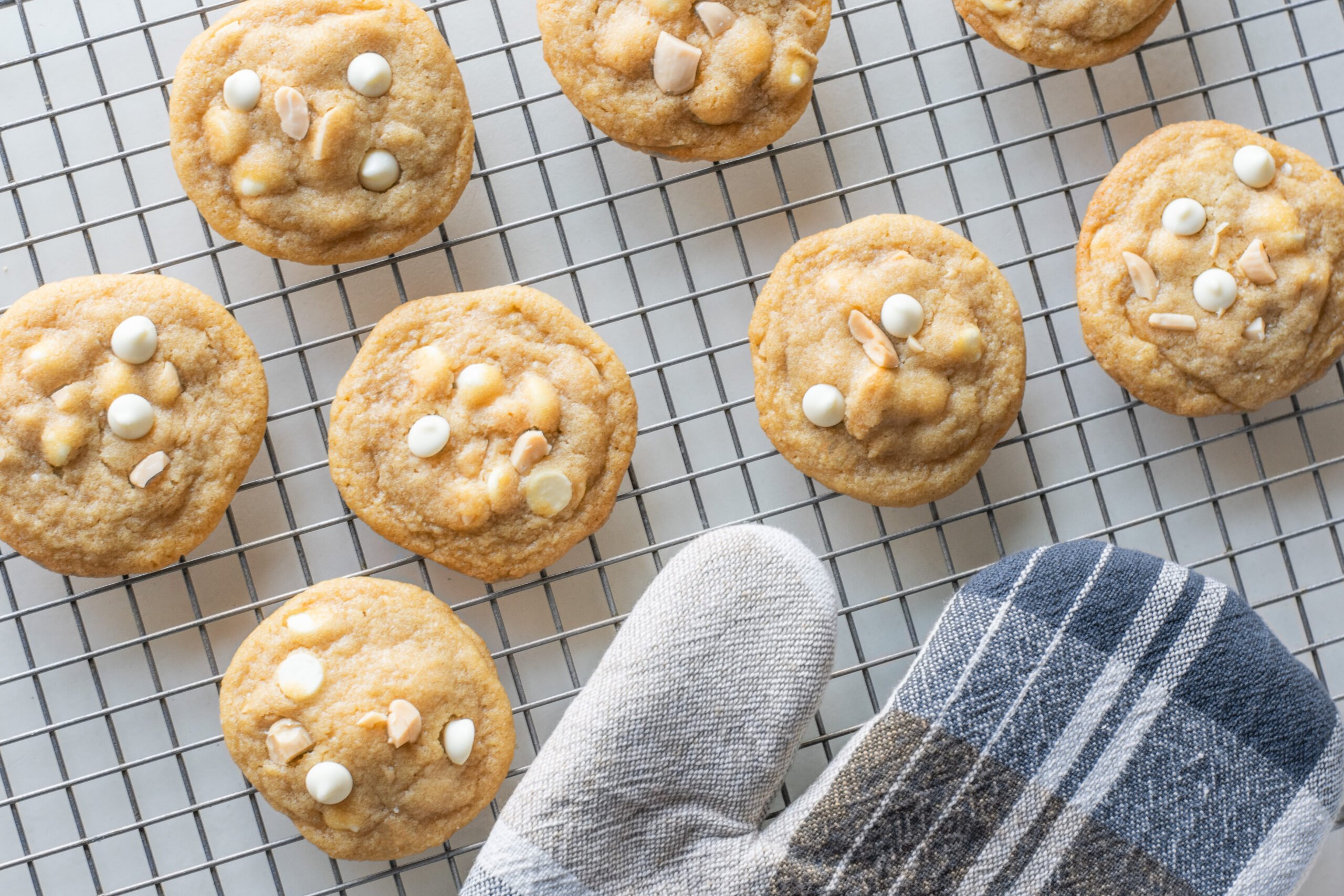 White Chocolate Chip Marcona Cookies on a baking rack