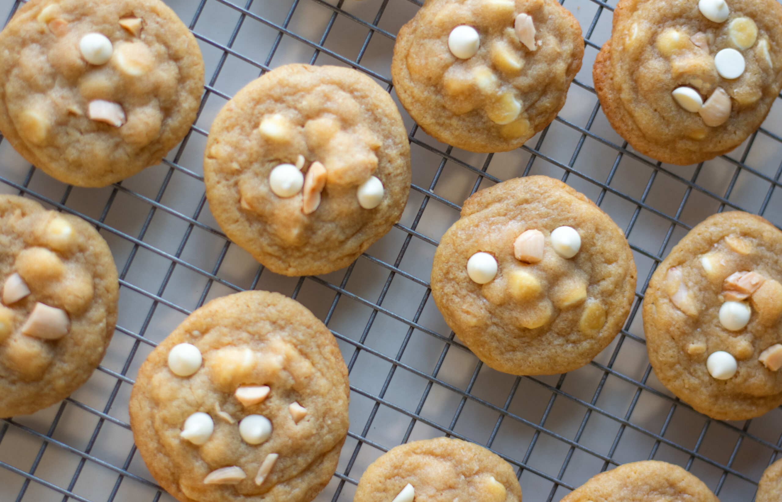 White Chocolate Chip Marcona Cookies on a baking rack