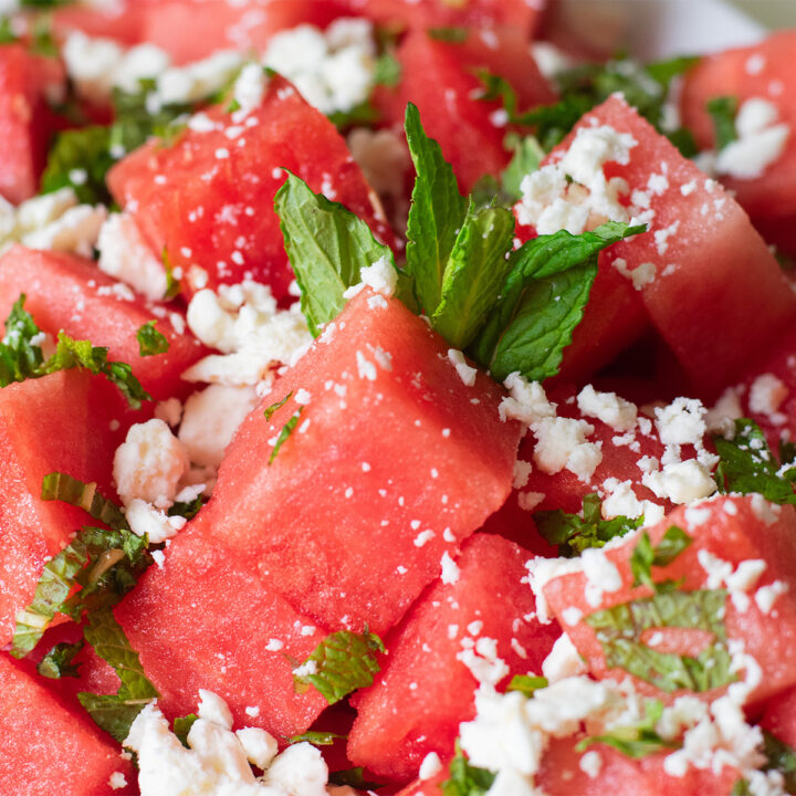 Detailed close-up of sweet and salty watermelon salad with feta and mint