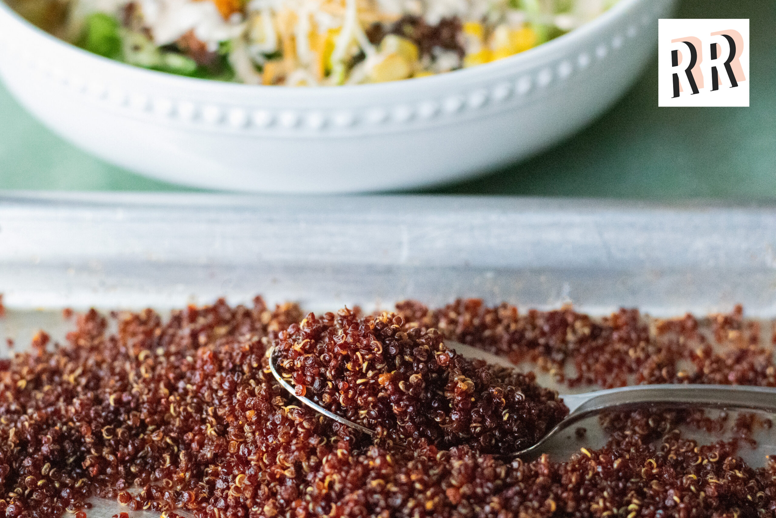 Pan of crispy red quinoa cooked to golden perfection with Realest Real Blog logo overlay.