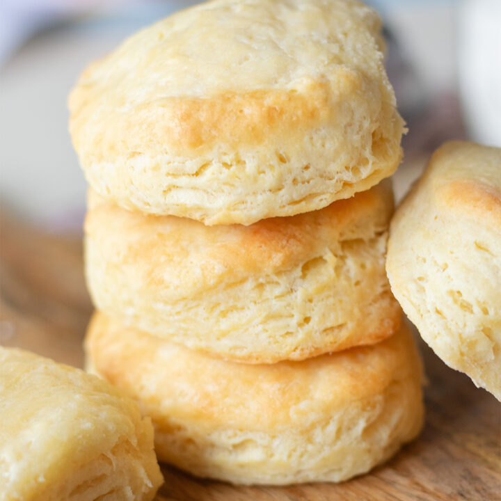 Stack of flaky, golden biscuits from an easy buttermilk biscuit recipe with buttery layers